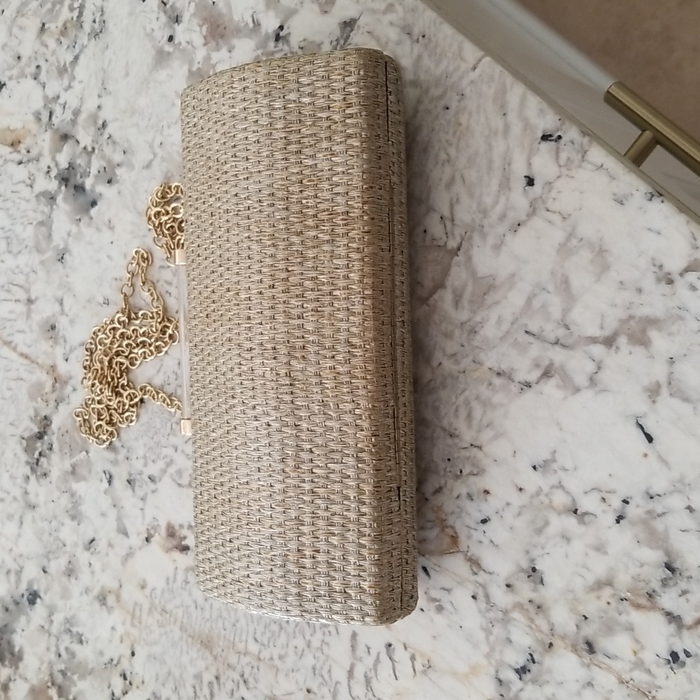 Pretty rattan gold Neiman Marcus clutch with or without chain.